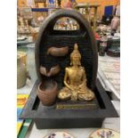A BOXED TABLE TOP 'SERENE WATER FOUNTAIN' WITH ELECTRIC WATER PUMP DEPICTING A BUDDHA