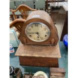 A WOODEN CASED MANTEL CLOCK WITH WOODEN PEDASTEL BASE