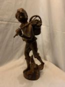 A PAINTED SPELTRE FIGURINE OF A TRAVELLING BOY HEIGHT 37CM