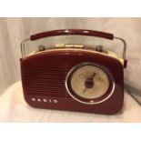 A RETRO RED AND CREAM RADIO WORKING AT TIME OF LOTTING BUT NO WARRANTY