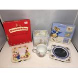 A WEDGWOOD BEATRIX POTTER MUG, A WEDGWOOD PETER RABBIT PHOTO FRAME AND A ROYAL DOULTON BUNNYKINS