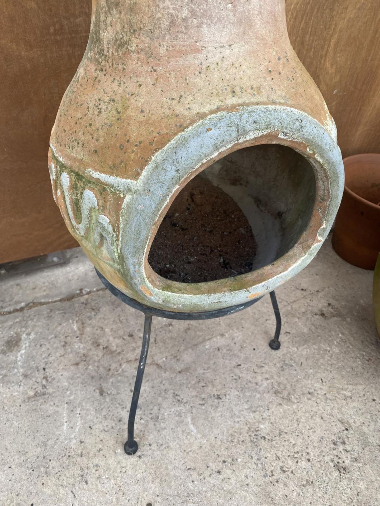 A TERRACOTTA CHIMENEA WITH METAL STAND - Image 2 of 4