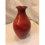 A RED FLAMBE METAL VASE HEIGHT 24CM