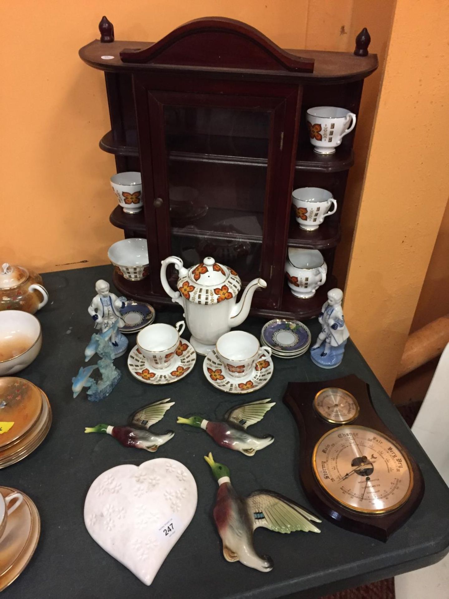 A SMALL WALL CABINET WITH A CLEAR GLASS DOOR AND A NUMBER OF ROYAL STAFFORD CERAMIC WARE, A