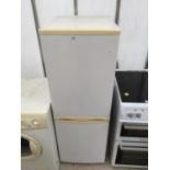 A WHITE UPRIGHT FRIDGE FREEZER