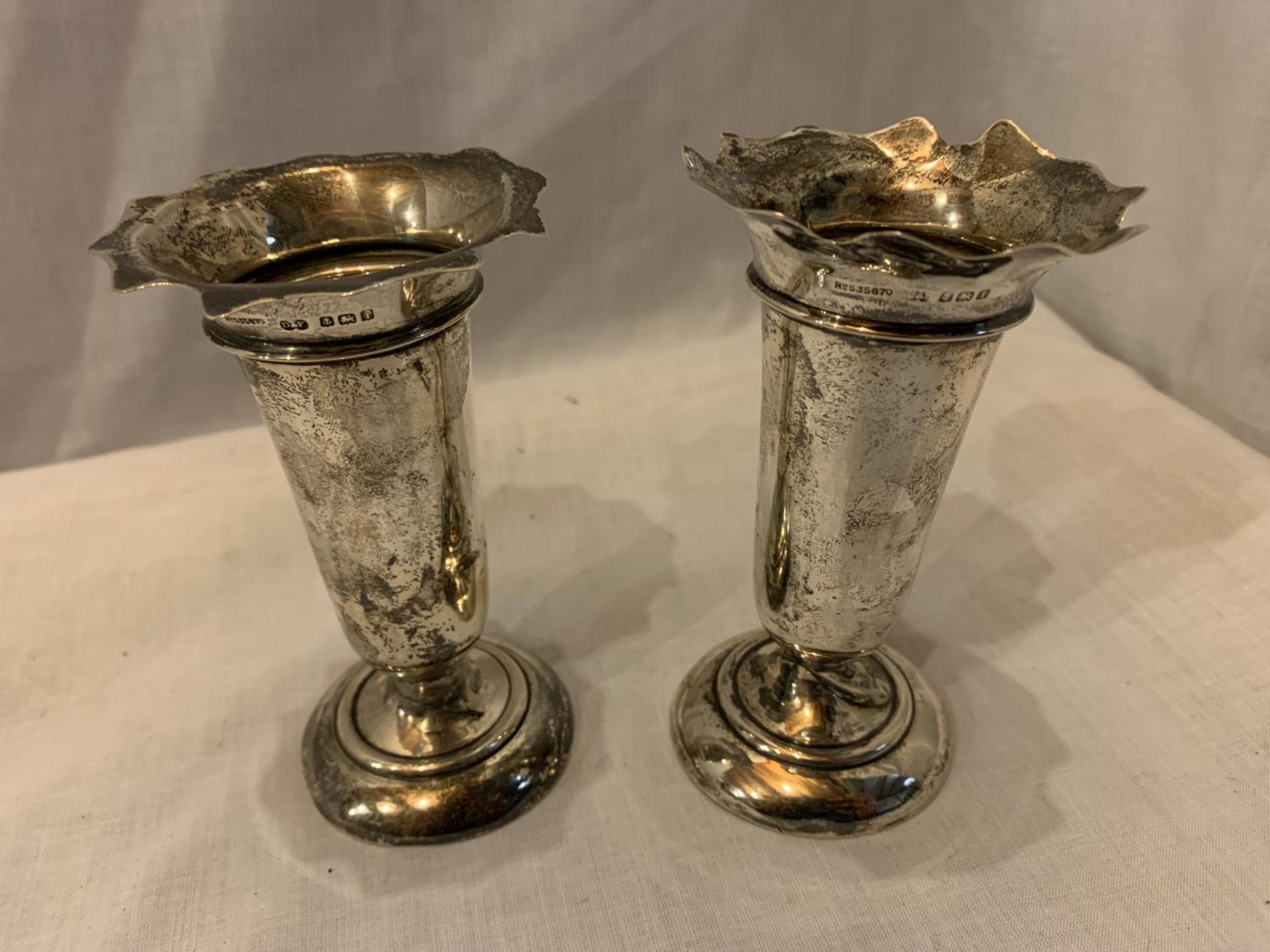 A PAIR OF HALLMARKED BIRMINGHAM SILVER BUD VASES