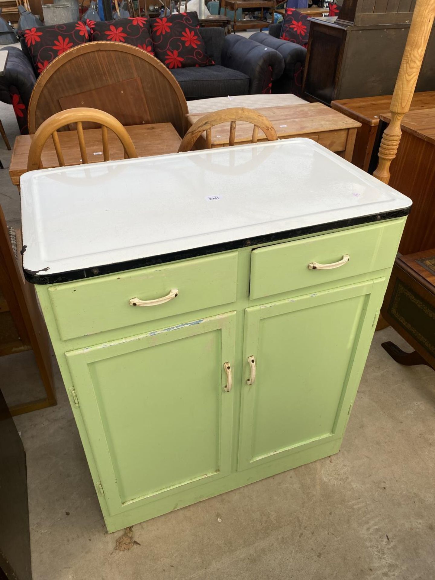 A 1950'S VIVID GREEN KITCHEN UNIT WITH BLACK AND WHITE ENAMEL TOP, 30" WIDE