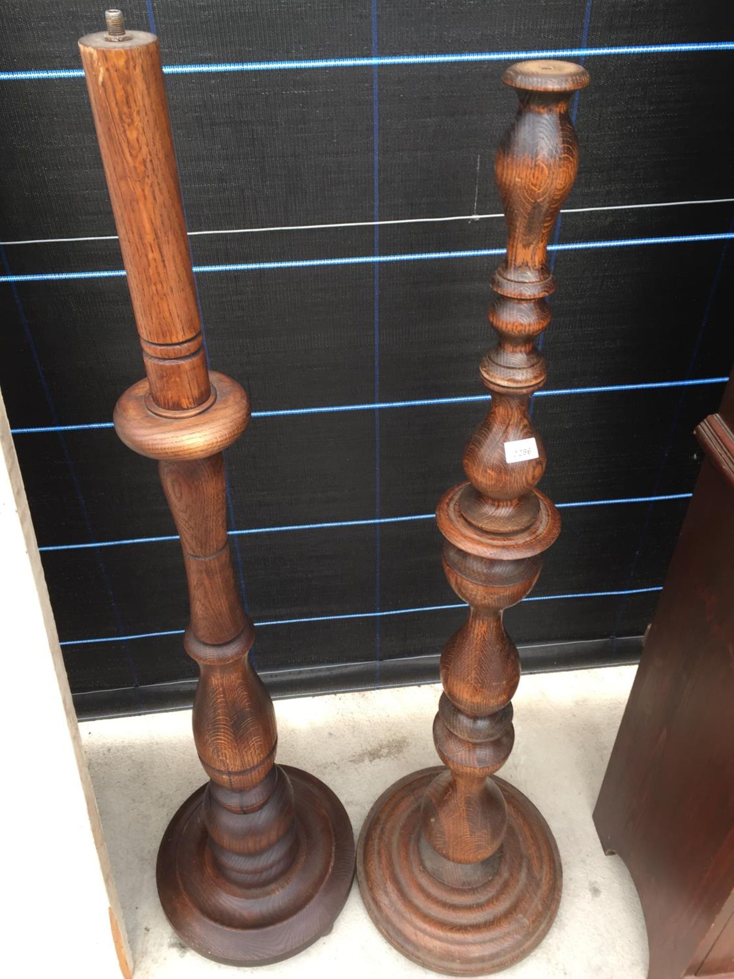 TWO SIMILAR OAK STANDARD LAMPS WITH TURNED COLUMNS