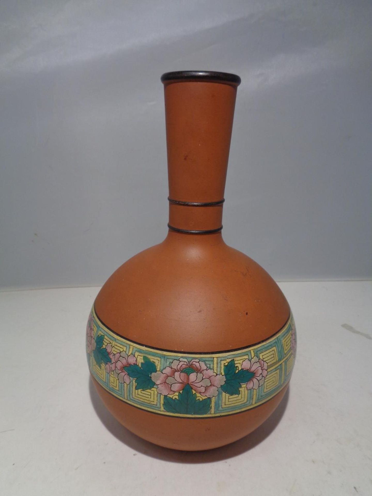 A DB &CO ETRURIA TERRACOTTA VASE WITH A FLOWER DESIGN