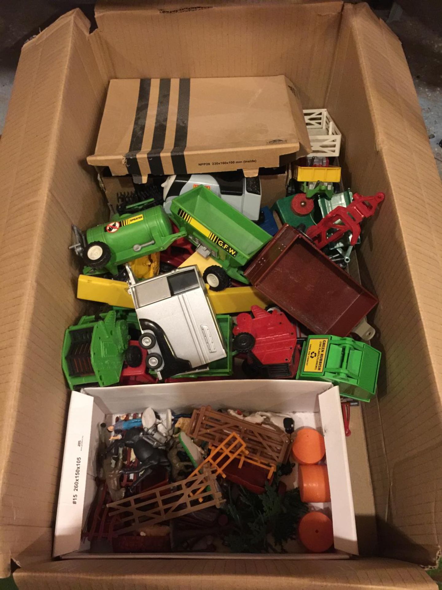 A BOX OF FARMYARD RELATED VEHICLES AND ANIMALS