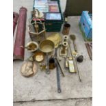 A LARGE ASSORTMENT OF BRASS ITEMS TO INCLUDE CANDLESTICKS, WEIGHTS, A PAN AND A PESTLE AN MORTER ETC