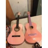 TWO PINK ACCOUSTIC GUITARS