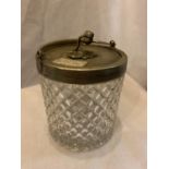 A BISCUIT BARREL BY PERCIVAL VICKERS MANCHESTER DIAMOND LOZENGE CUT GLASS AND A SILVER PLATED LID,