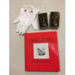 A SWAROVSKI 'THE MAGIC OF CRYSTAL' BOOK, A PAIR OF SWAROVSKI GLOVES AND TWO KEYRINGS