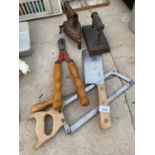 AN ASSORTMENT OF TOOLS TO INCLUDE TWO VINTAGE FLAT IRONS, A MEAT CLEAVER AND A HACKSAW ETC