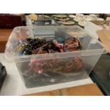 A LARGE BOX OF COSTUME JEWELLERY TO INCLUDE BEADS, NECKLACES, BANGLES, ETC