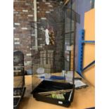 A LARGE PET CAGE WITH BOWLS, A LADDER AND A HANGING POUCH IN CLEAN CONDITION