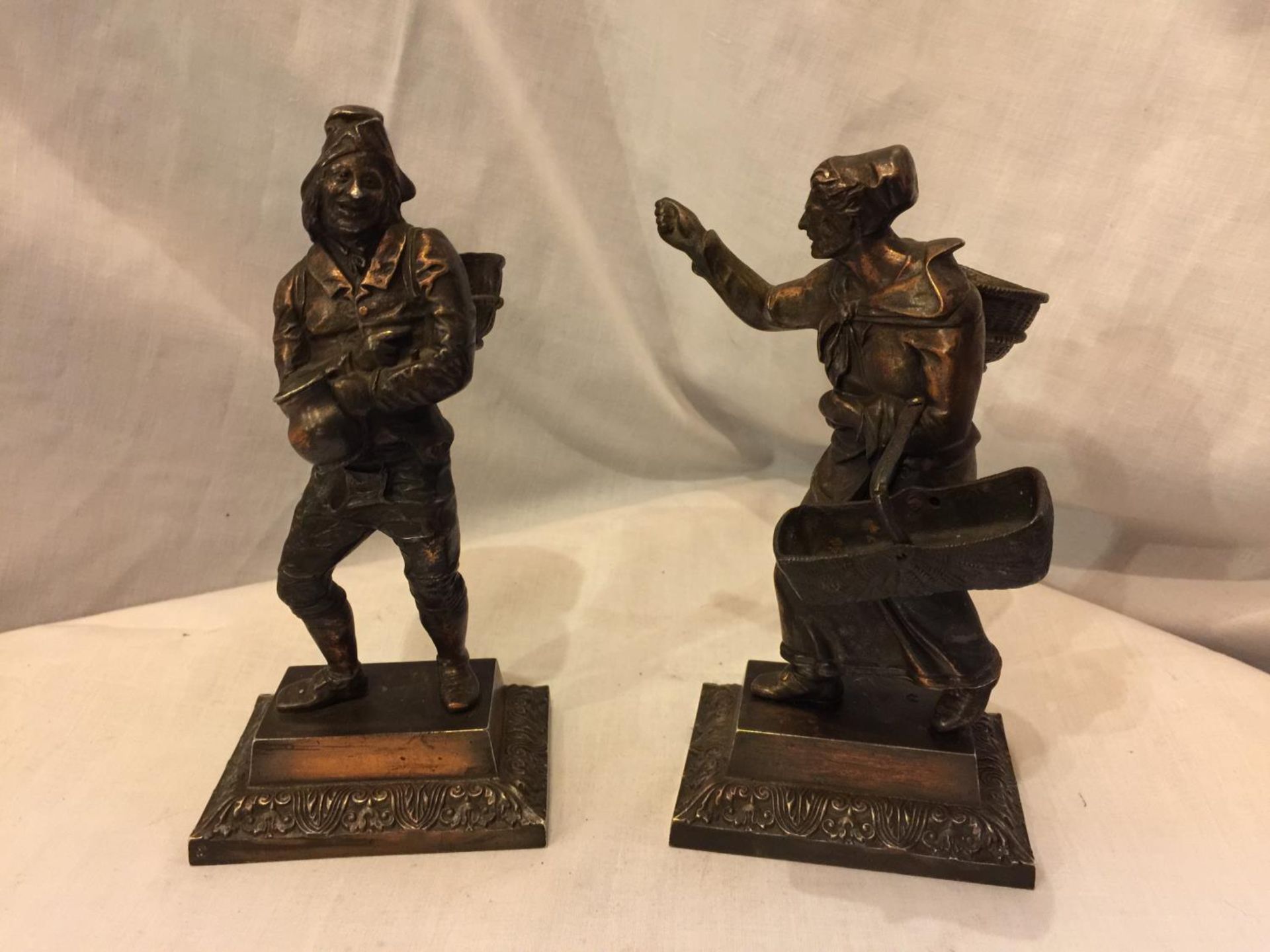 A PAIR OF BRONZE DIPPED FRENCH GRAPE PICKER METAL FIGURINES