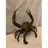 A POSSIBLY BRONZE RAISED CRAB ORNAMENT, ARM A/F