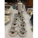 A STONEWARE RETRO COFFEE SET TO INCLUDE, COFFEE POT, MILK JUG, SUGAR BOWL, SIX CUPS AND SAUCERS