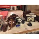 AVINTAGE LEATHER CASED ILFORD 'SUPER SPORTS' CAMERA, A VINTAGE LEATHER CASED VOIGHANDER CAMERA, ETC