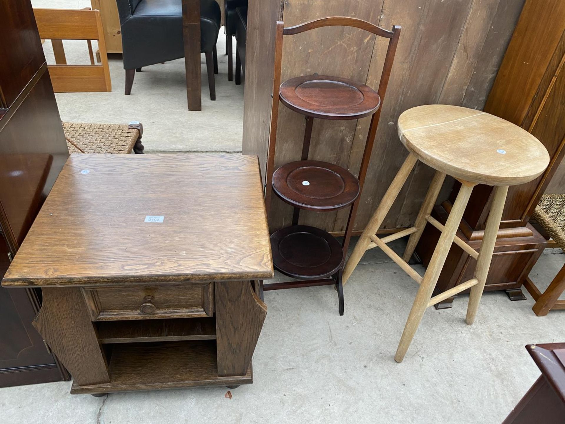 AN OAK LAMP TABLE/MAGAZINE RACK, AFTERNOON TEA STAND AND BEECH STOOL