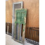 A VINTAGE WOODEN FRENCH WINDOW SHUTTER AND A VINTAGE WOODEN HUNGARIAN DOOR