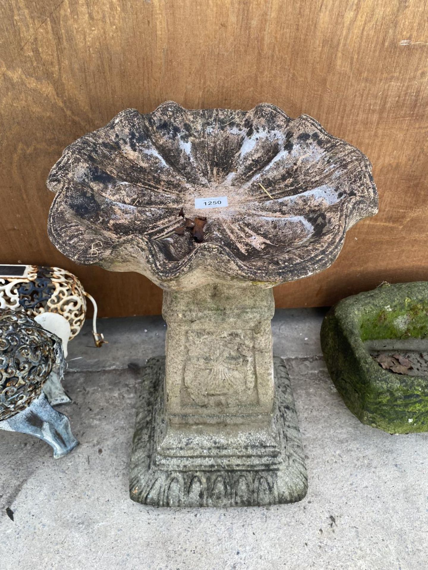 A RECONSTITUTED STONE BIRD BATH WITH PEDASTEL BASE