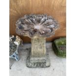 A RECONSTITUTED STONE BIRD BATH WITH PEDASTEL BASE