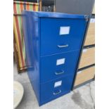 A METAL THREE DRAWER FILING CABINET