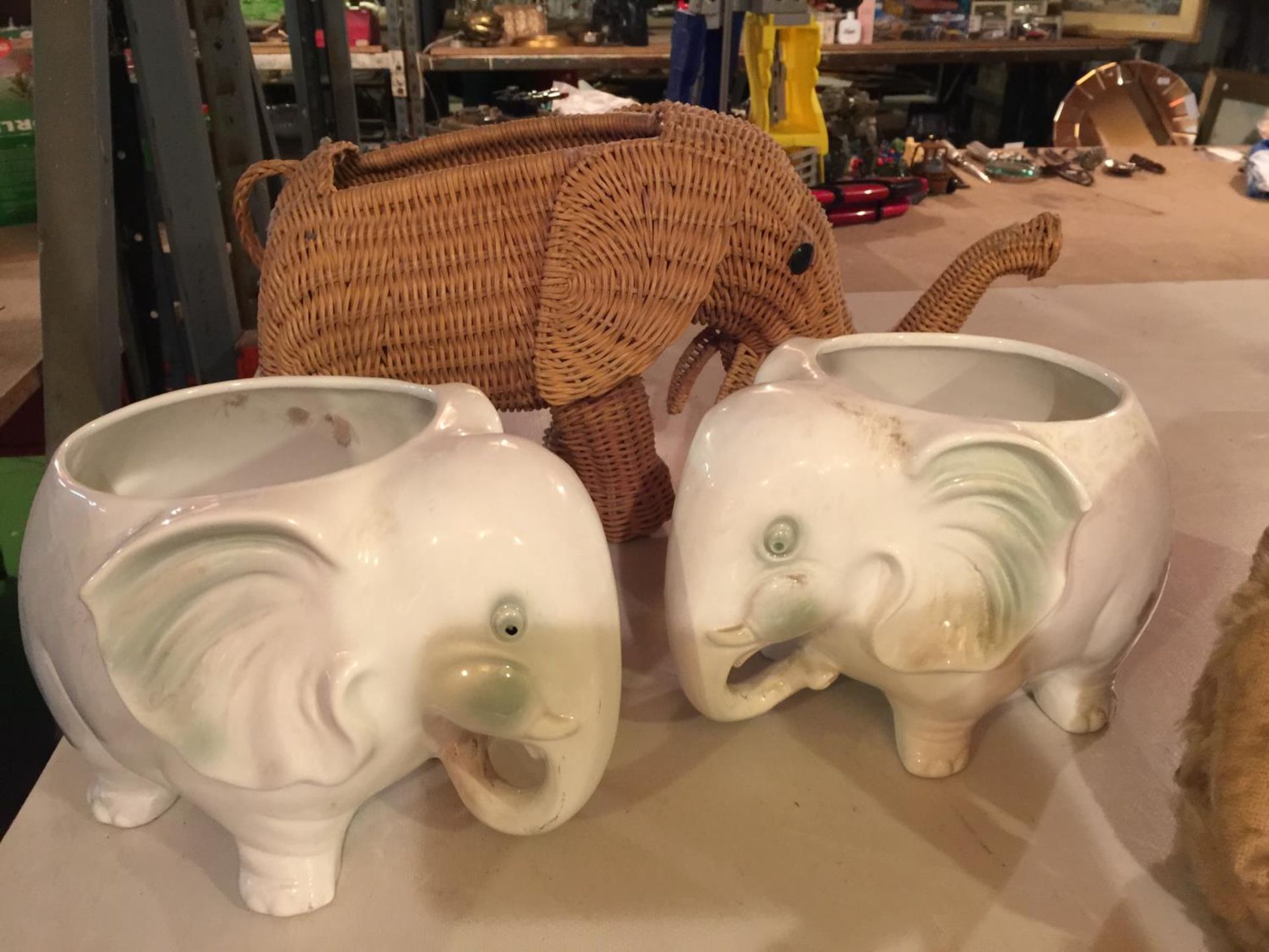THREE ELEPHANT PLANTERS TI INCLUDE A PAIR OF CERAMIC AND A WICKER