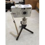 A CANON 3.2 MEGA PIXEL CAMERA ON TRIPOD STAND