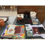 AN ASSORTMENT OF ITEMS TO INCLUDE VINTAGE CAMERAS, ROAD MAPS AND A DOCKING STATION ETC