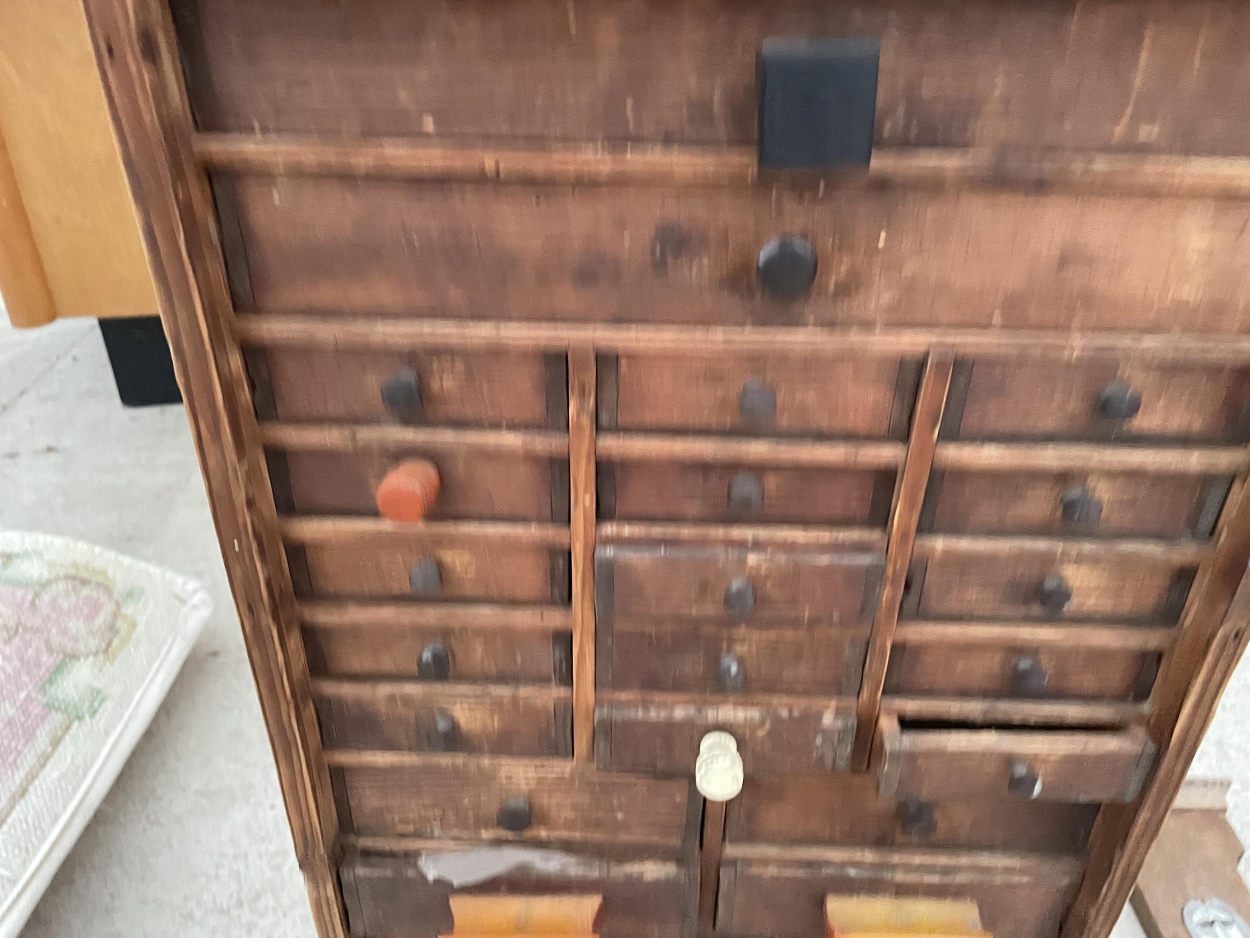 A VINTAGE VICTORIAN PINE WATCHMAKERS HABERDASHERY CABINET, ENCLOSING 24 VARIOUS SIZED DRAWERS AND TO - Image 2 of 4