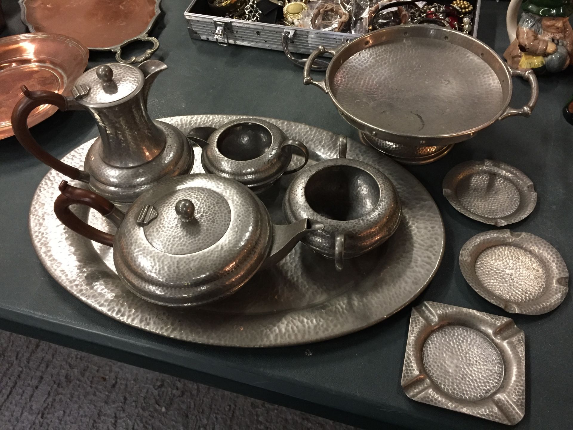 A PEWTER TEASET ON A TRAY, A PLATE ON A STAND AND THREE SMALLER PLATES