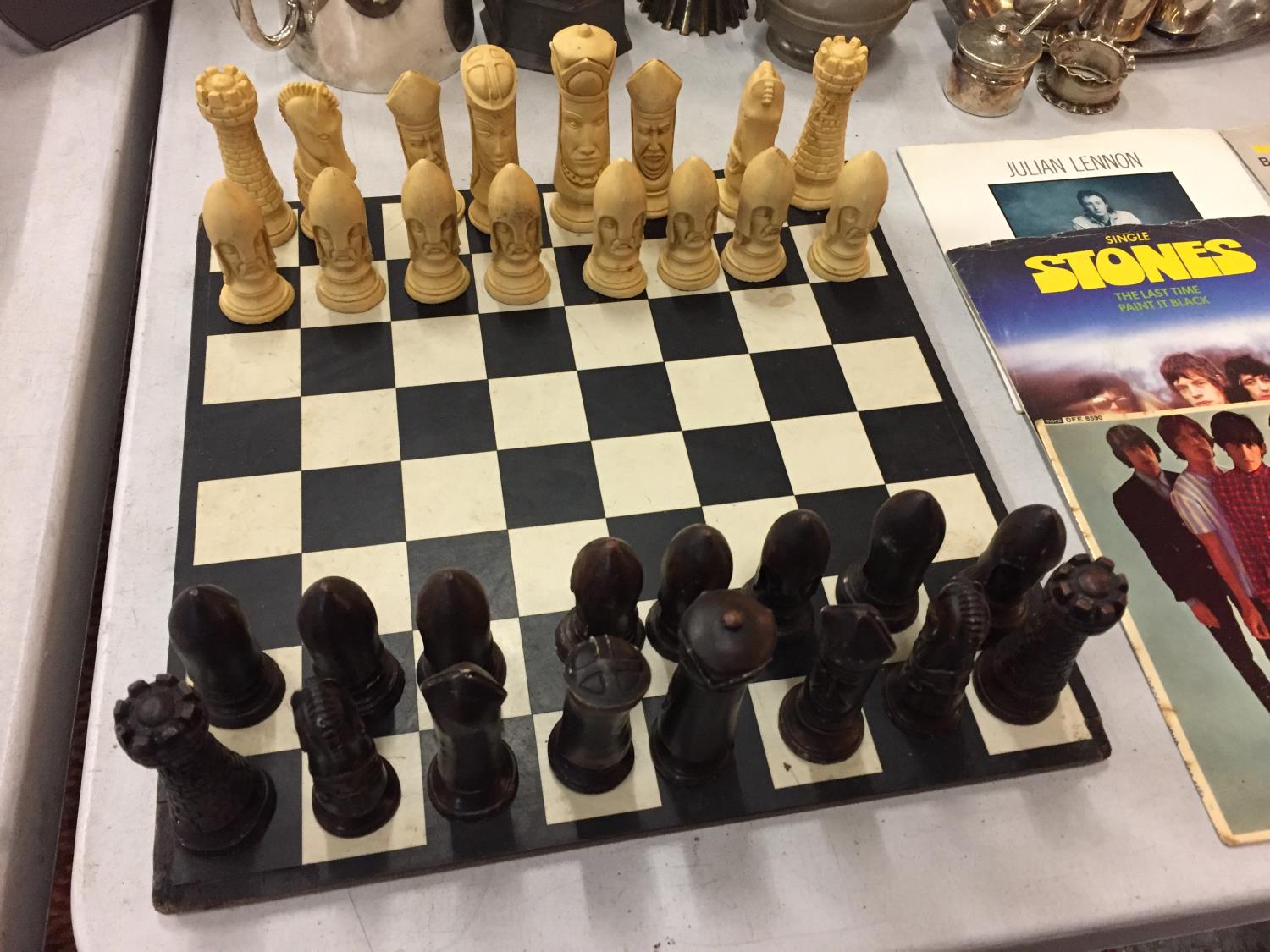 A COMPLETE CHESS SET WITH RESIN CHESS PIECES