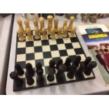 A COMPLETE CHESS SET WITH RESIN CHESS PIECES