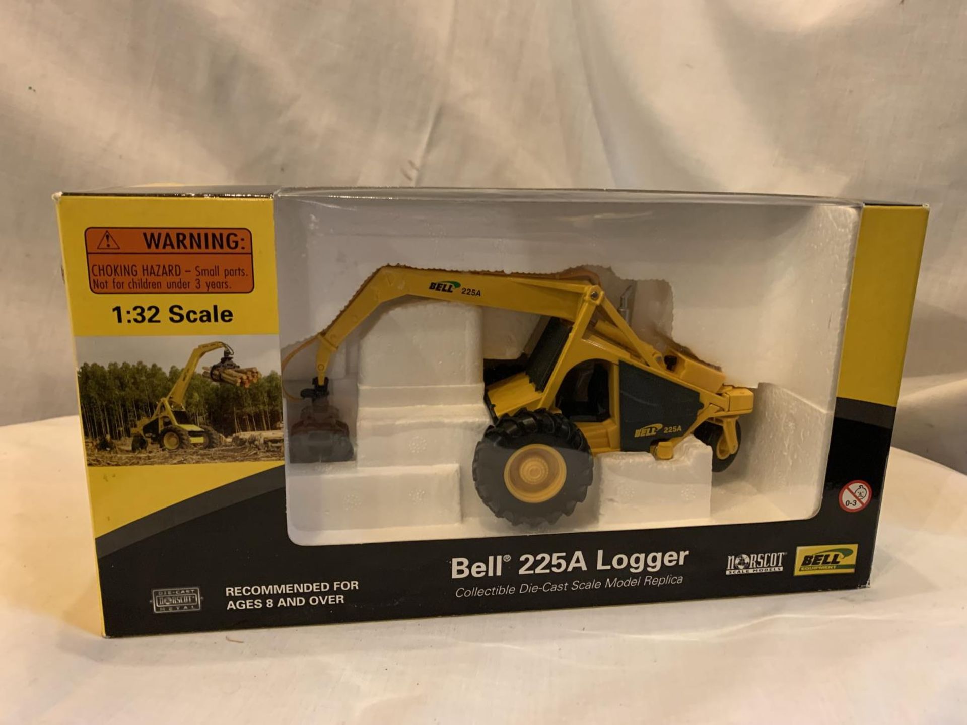 A BOXED NORSCOT BELL 225A LOGGER 1:32 SCALE MODEL