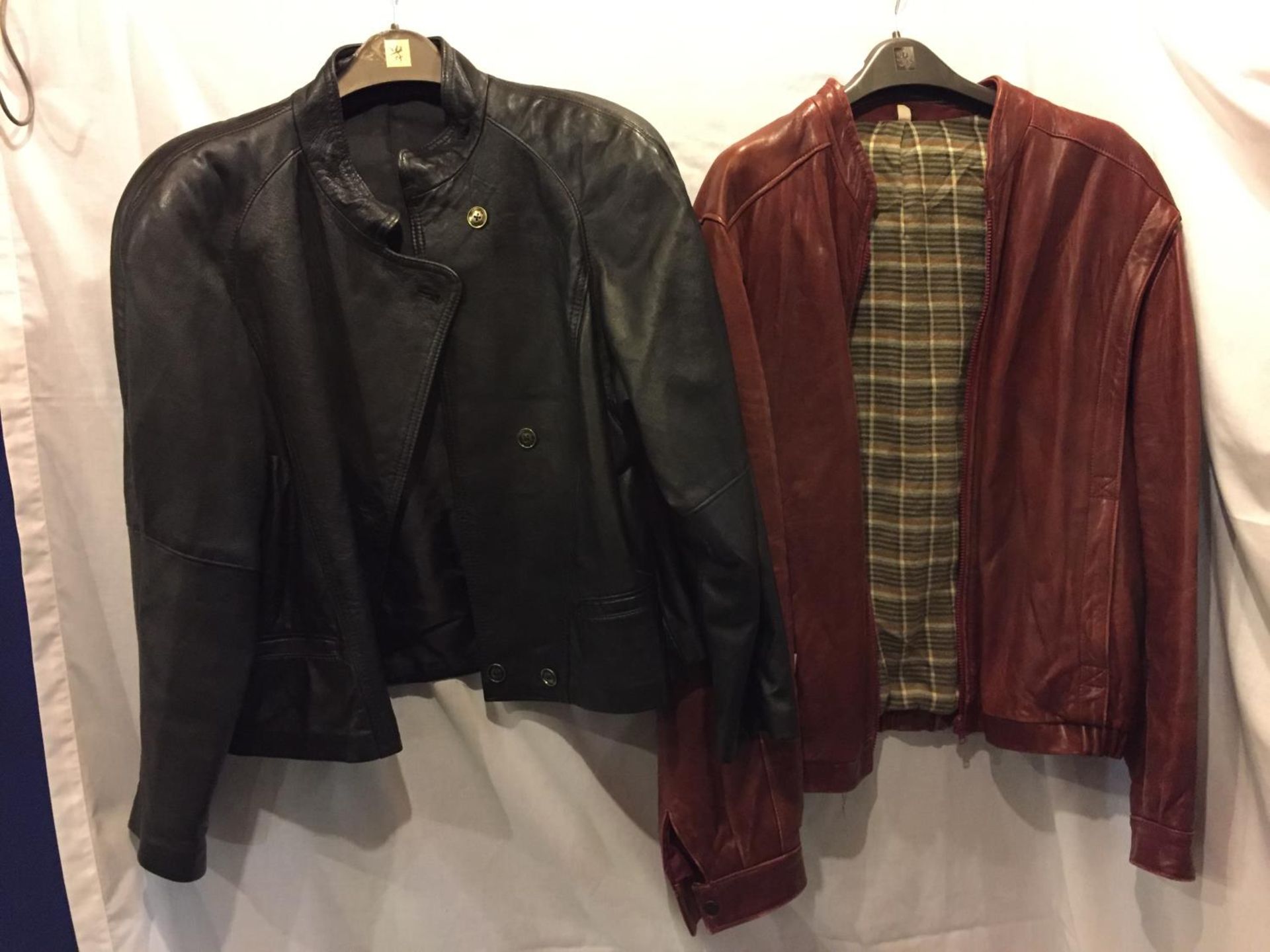 TWO LEATHER JACKETS, ONE BLACK AND ONE RED