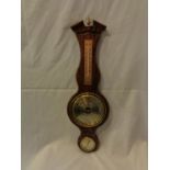 A WOODEN BAROMETER AND THERMOMETER