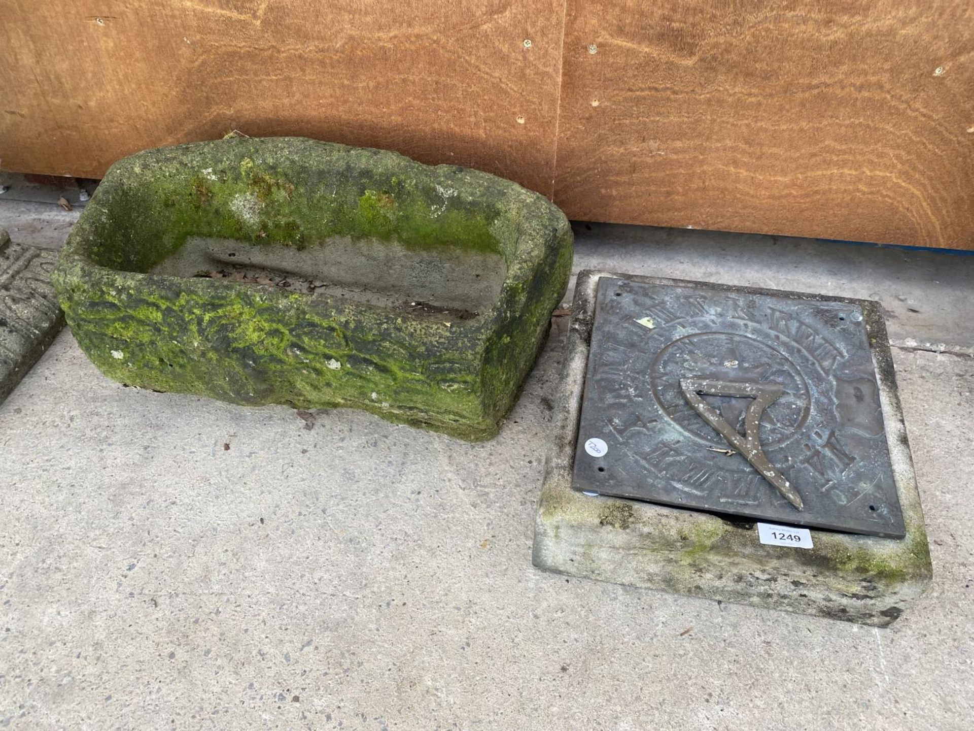 A SMALL STONE TROUGH AND A SUNDIAL TOP