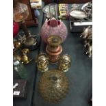 A BRASS OIL LAMP BASE PLUS TWO GLASS SHADES