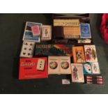 A QUANTITY OF PLAYING CARDS ALSO A BOXED GAMES SET, DOMINOES, ETC