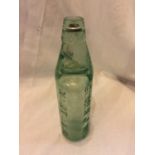 A GLASS GOMER JONES, NANTWICH VINTAGE BOTTLE COMPLETE WITH STOPPER