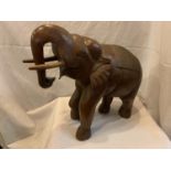 A LARGE HARDWOOD TREEN ELEPHANT