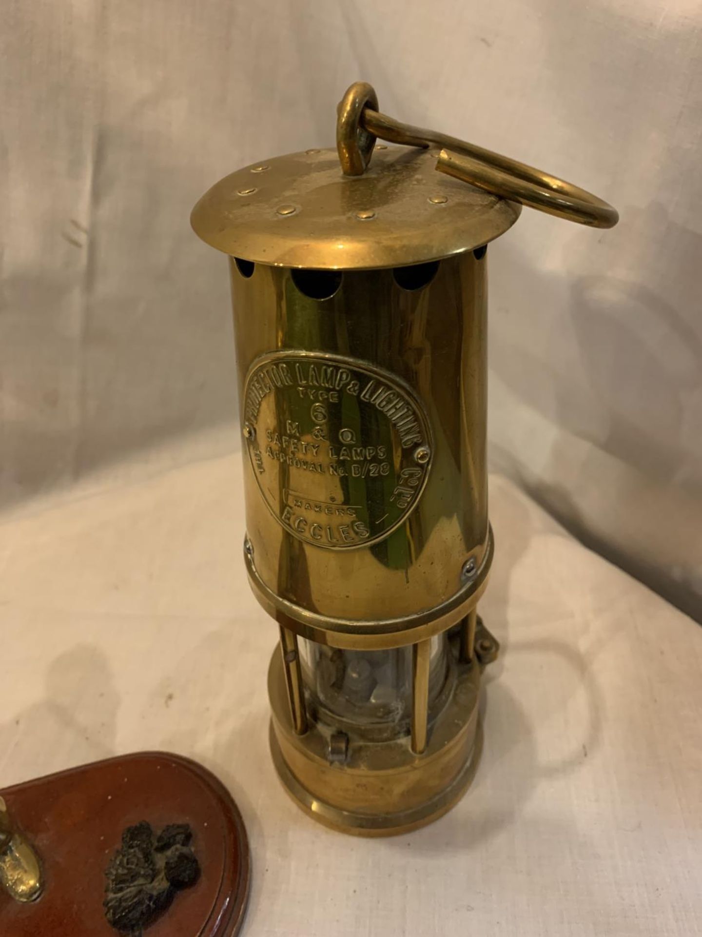 A HEAVY BRASS SAFETY LAMP AND A BRASS MINER WITH COAL ON A PLINTH - Image 3 of 3