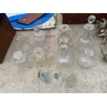 AN ASSORTMENT OF GLASS WARE TO INCLUDE DECANTORS AND A CANDLE HOLDER ETC