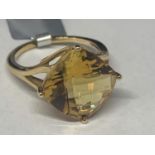 A 9 CARAT GOLD RING WITH CITRINE COLOURED DIAMOND SHAPED STONE SIZE N GROSS WEIGHT 3.7 GRAMS IN A