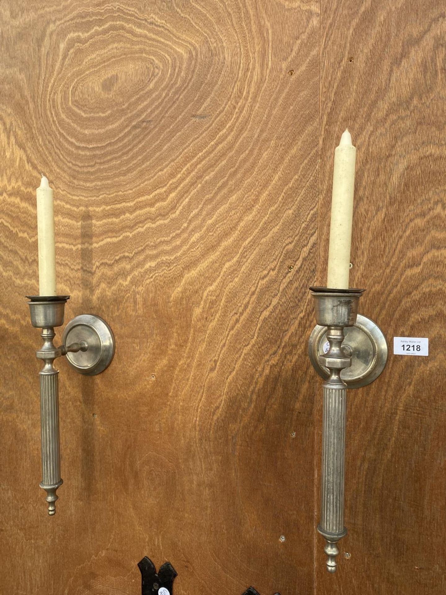 A PAIR OF VINTAGE NIKEL PLATED BRASS TORCHERY WALL SCONCES