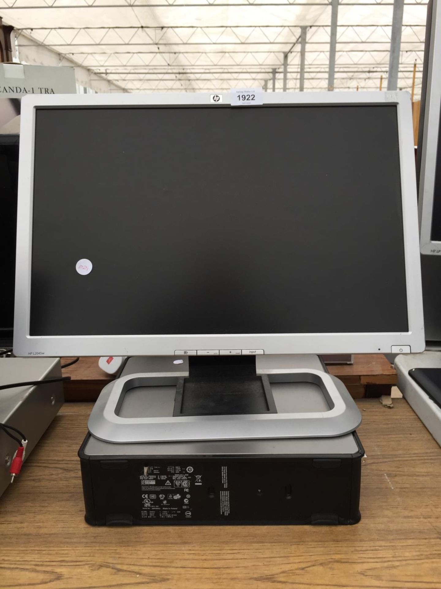 A HP MONITOR AND A COMPUTER TOWER